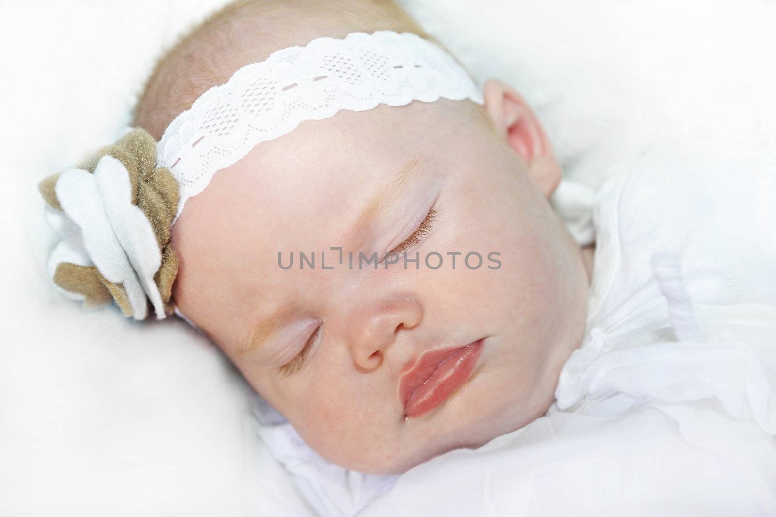 Adorable baby girl with headband  sleeping peacefully
