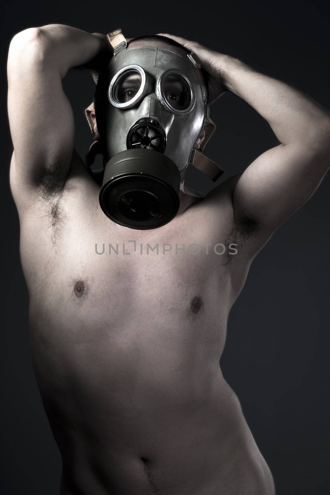 Naked man with protective gas mask