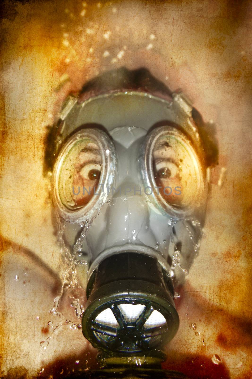 Man in gas mask with water reflection in the eyes over artistic background