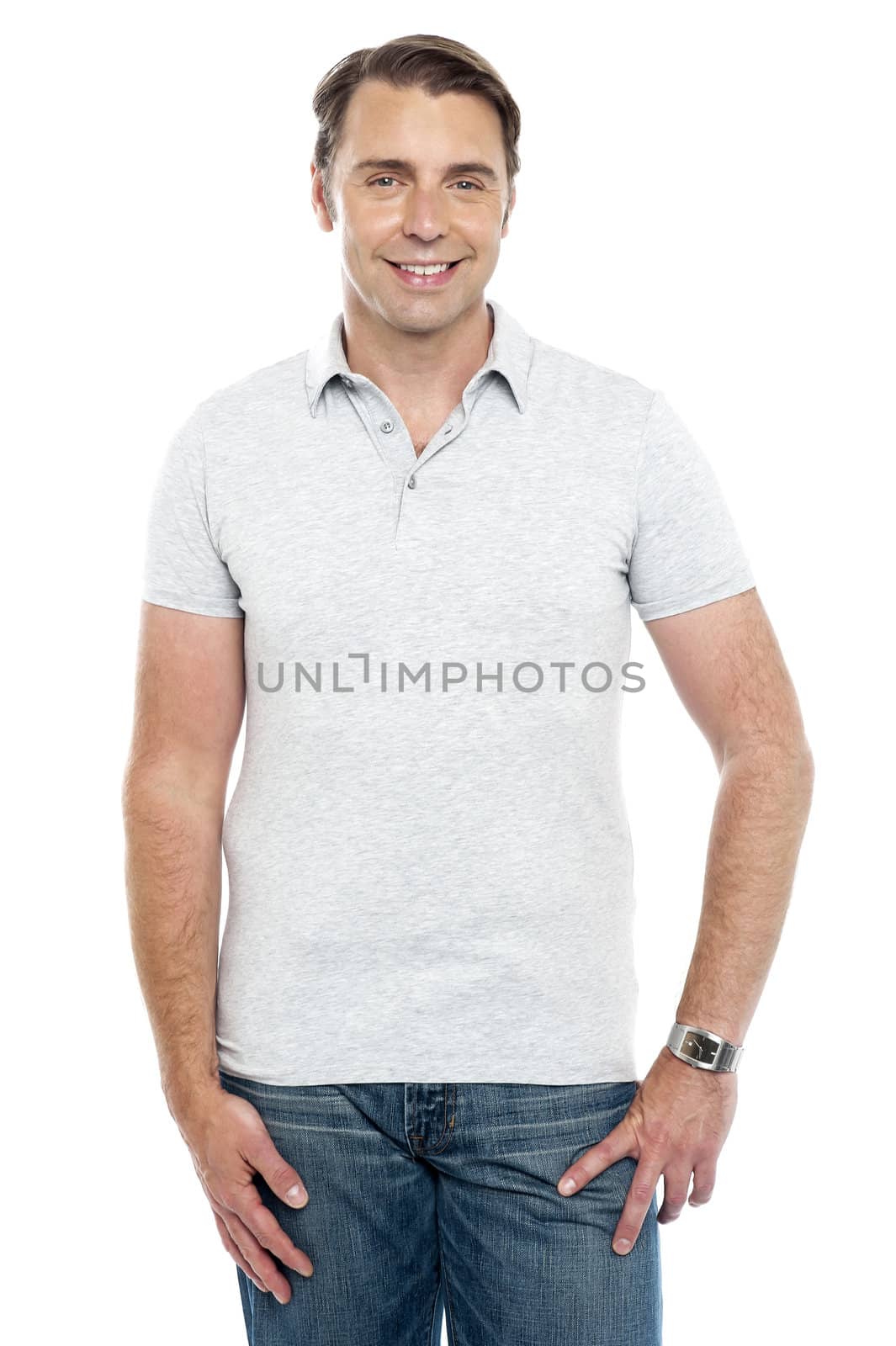 Casual portrait of smiling young man isolated against white background