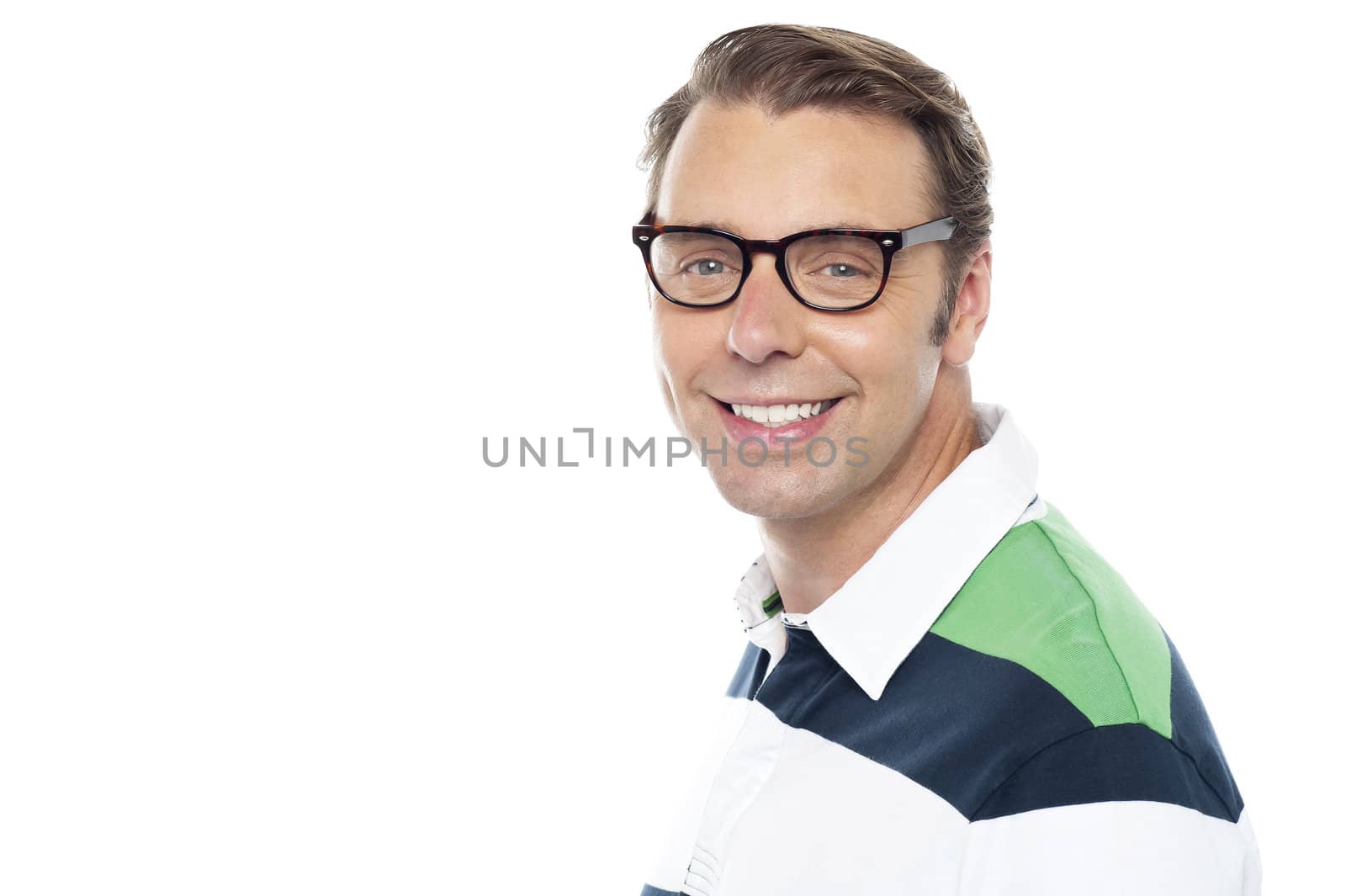Closeup shot of cheerful young casual guy looking at you