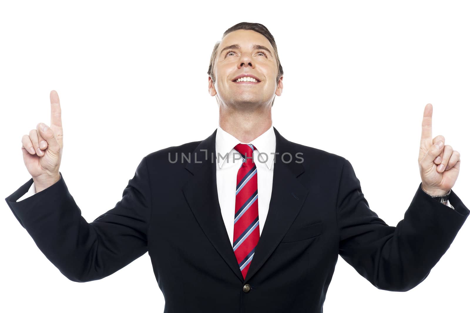 Executive looking upwards and pointing to isolated on white