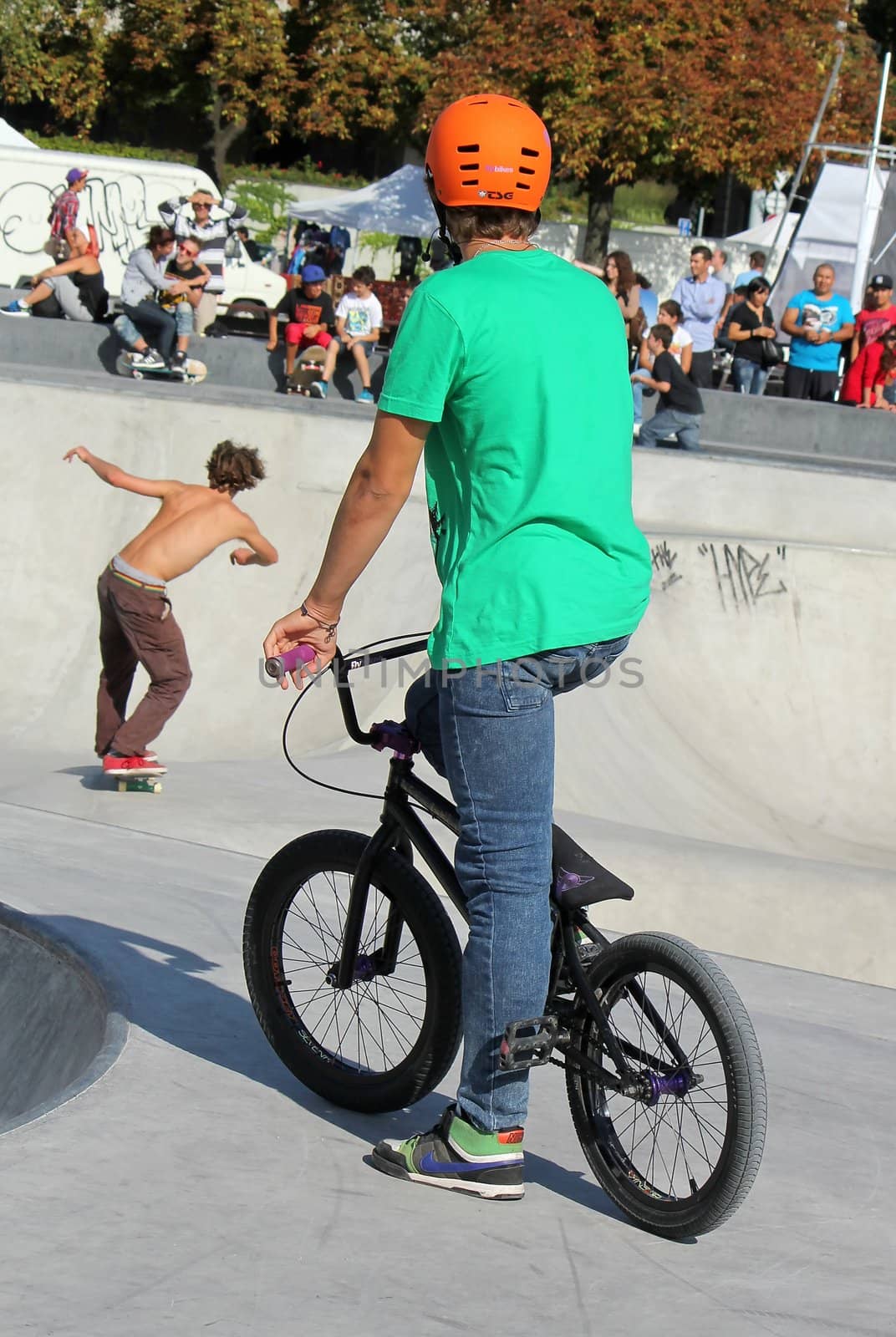 BMX biker and skater in the skate park by Elenaphotos21