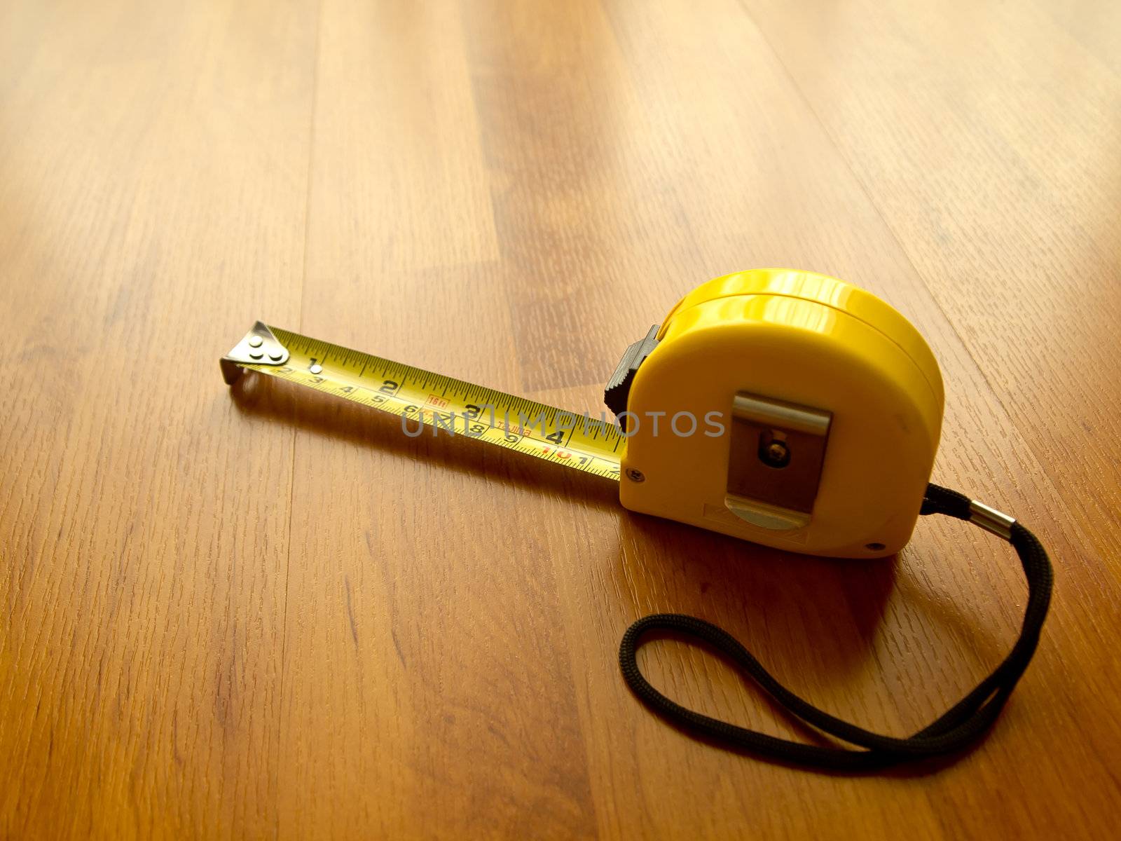 Measuring tape on laminate by gjeerawut