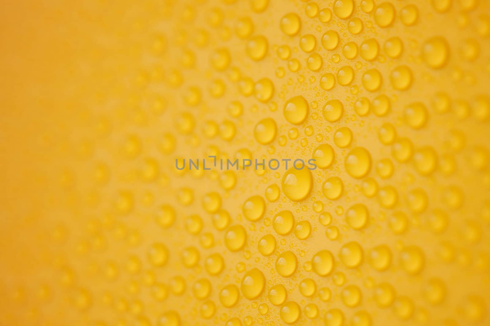 Abstract water-drops on yellow