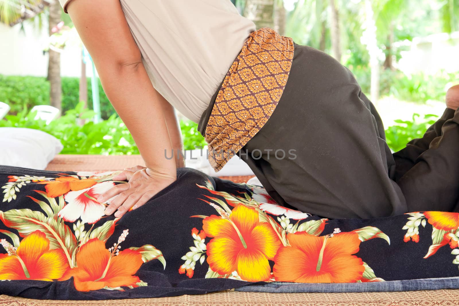 Full Back Massage Spa with Hand in tropical garden for wellness and healthy background