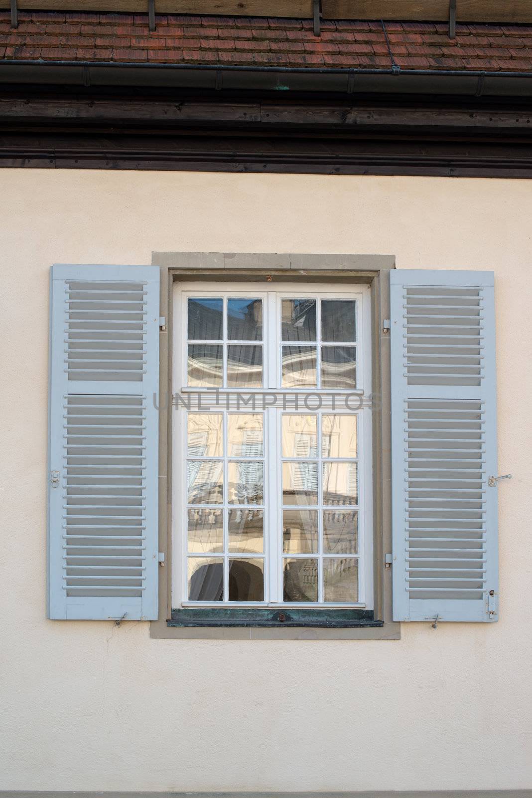 Window reflecting the rococo style Palace of the Solitude in Stuttgart, Germany was built as summer residence between 1764 and 1769 under Duke Karl Eugen of Württemberg.
