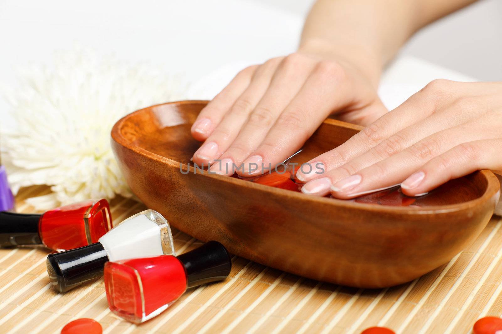Woman is getting manicure by sergey_nivens