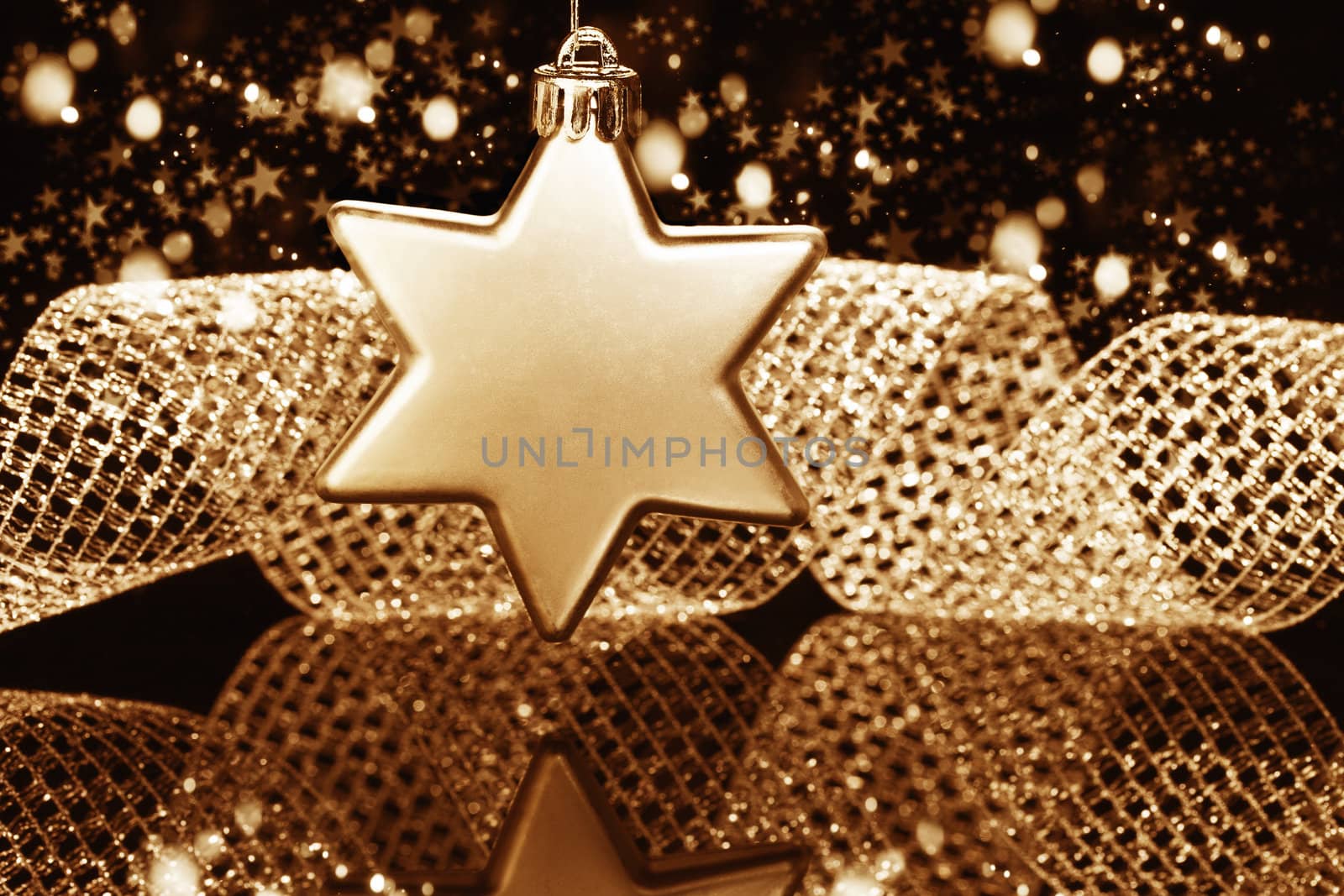 christmas ball in star shape in front of a metal ribbon by RobStark