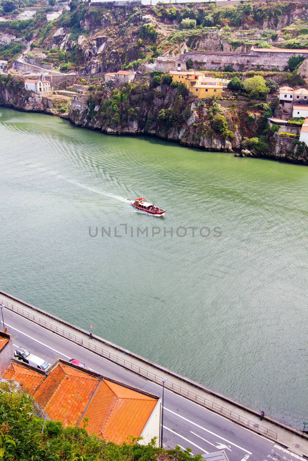 boat floats on the river Douro,Porto, Portugal by 1shostak
