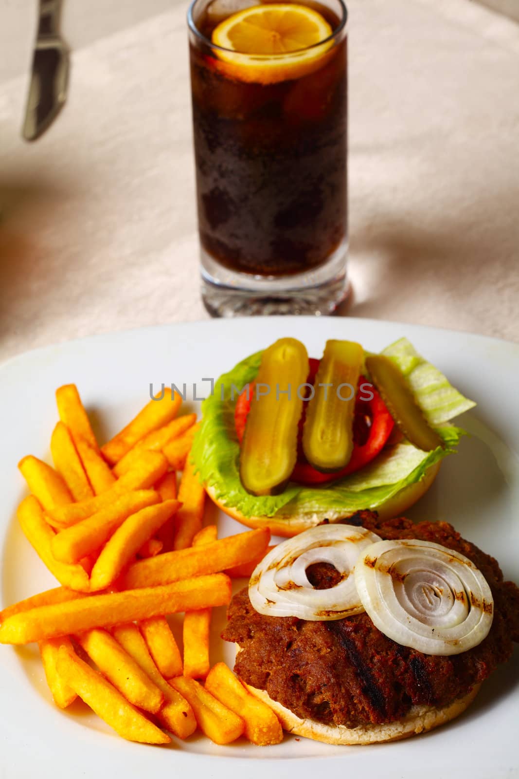 Open hamburger with cola and french fries