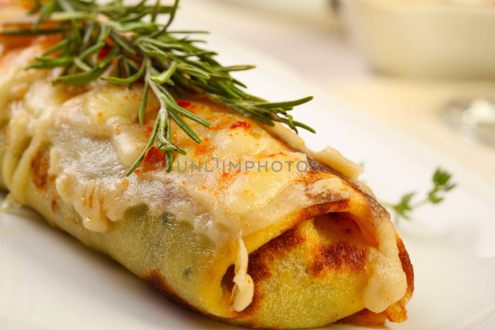 Baked cannellone with cream and cheese