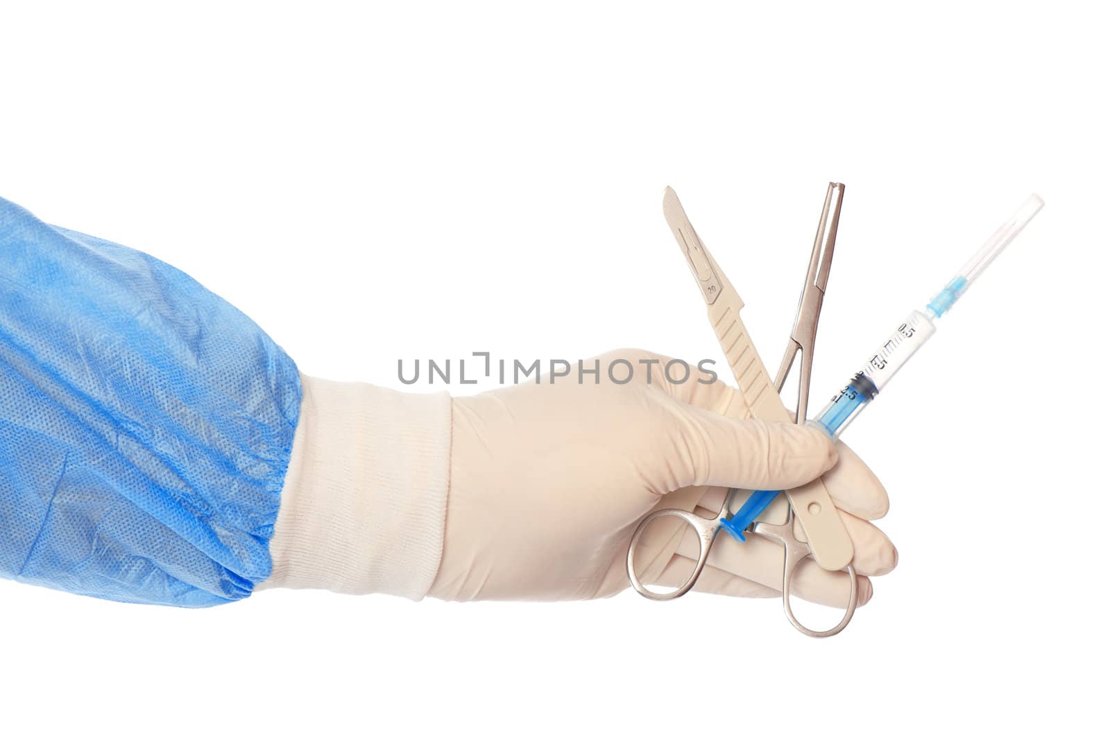 syringe, scalpel and clamp in the hand of the surgeon during a surgery