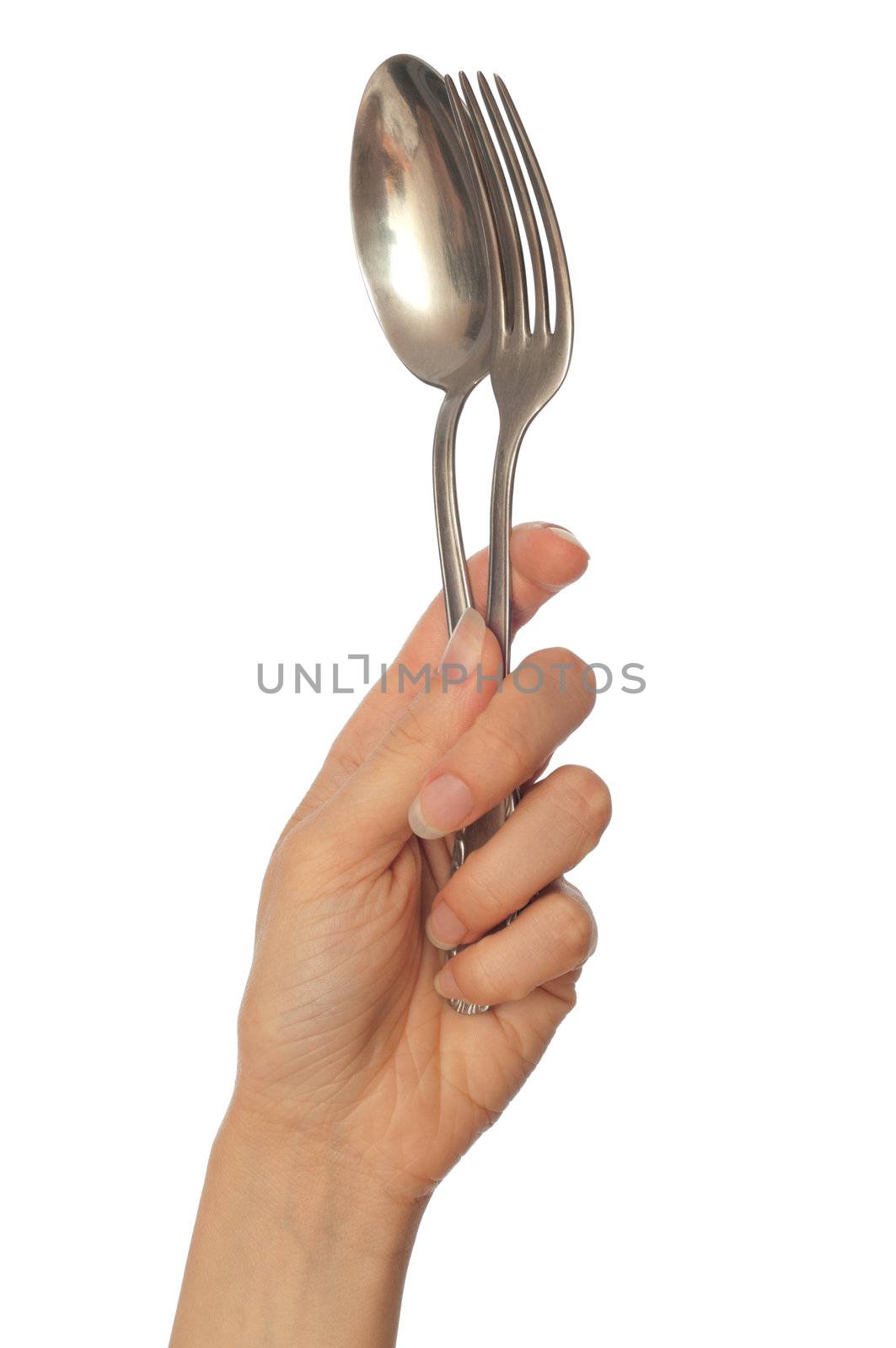 woman holding tablespoon and fork in the hand to tableware the dinner