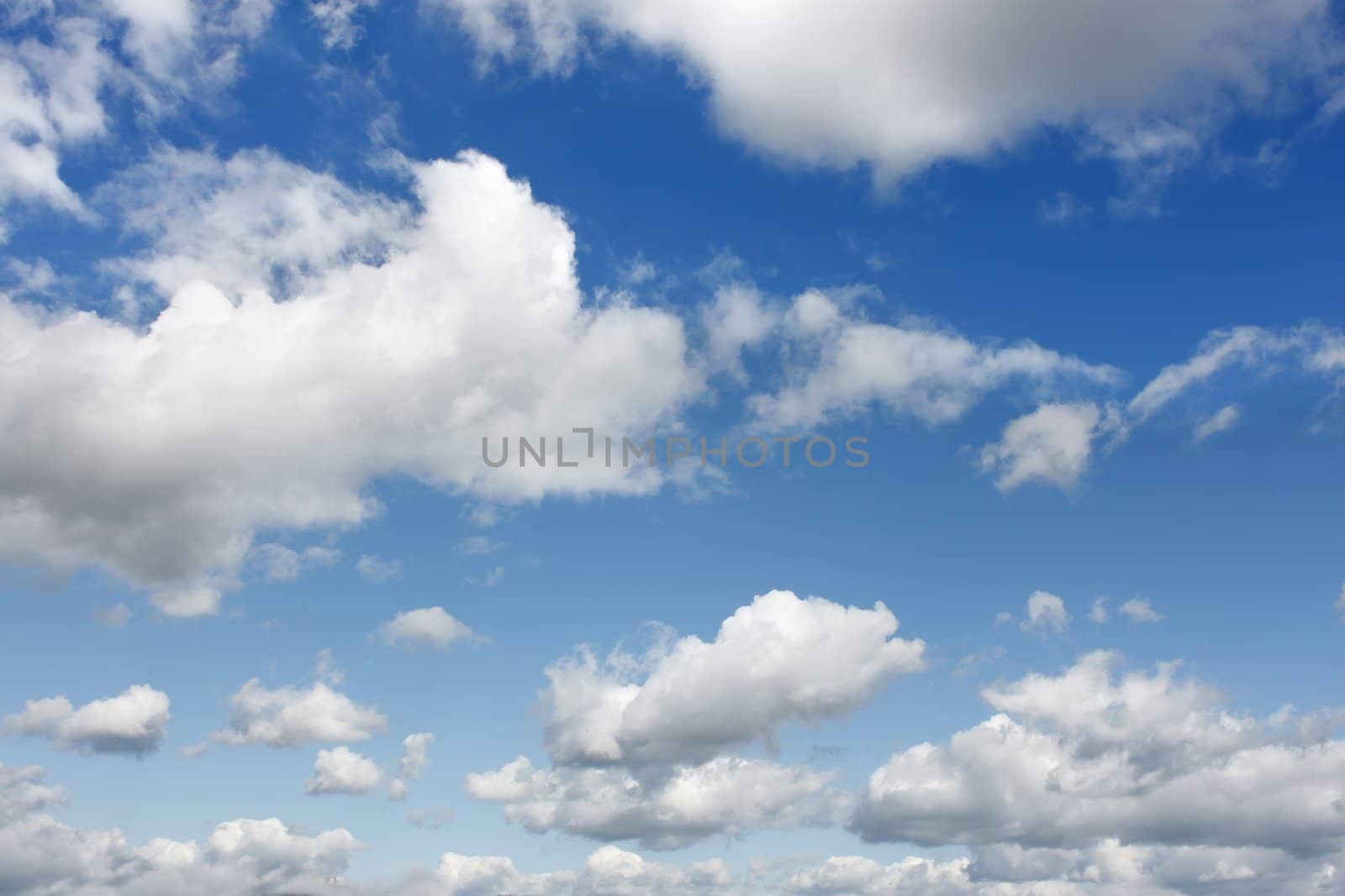 Light white clouds flying on the blue sky