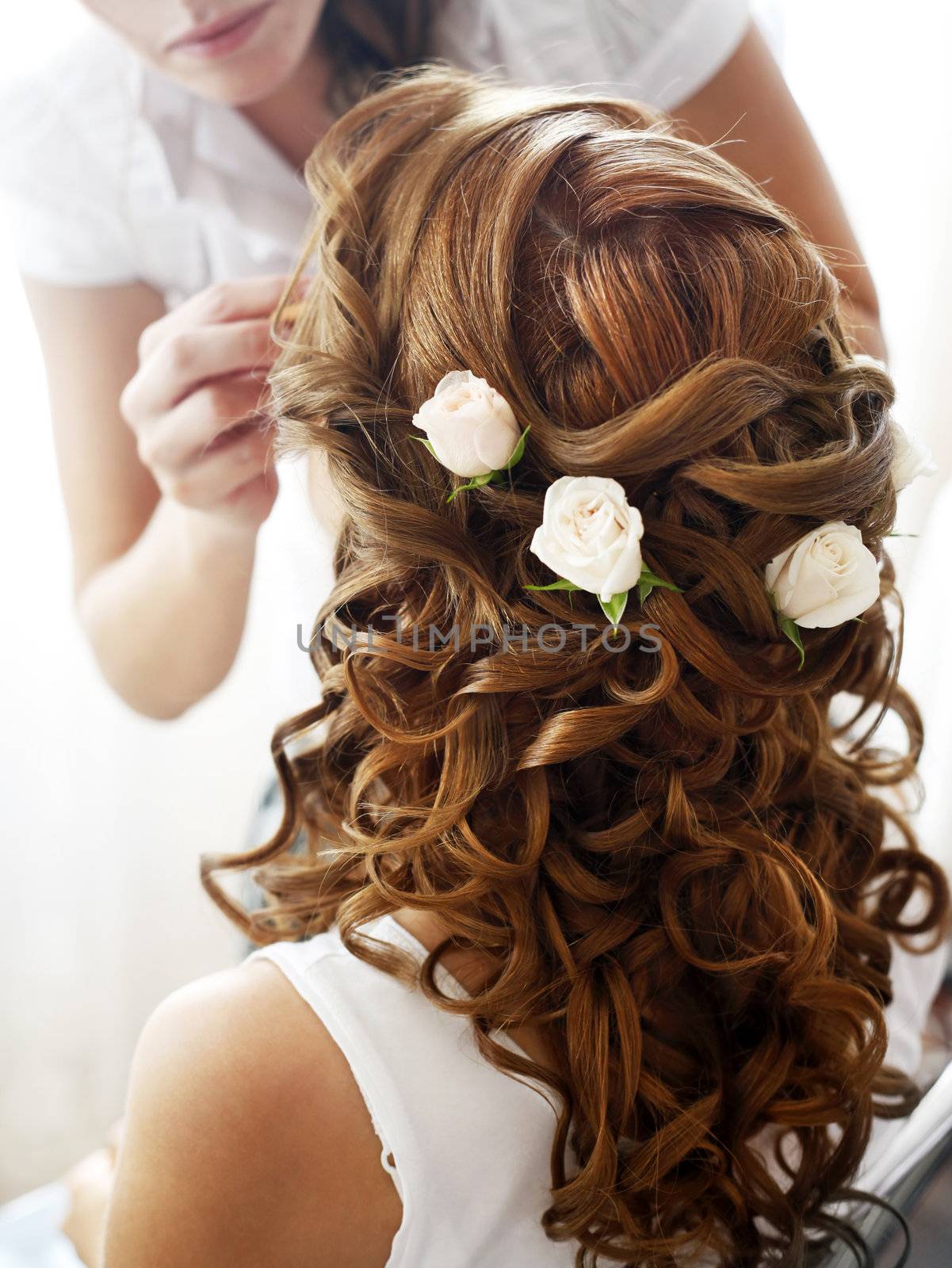 Hairdress of the bride decorated with flowers