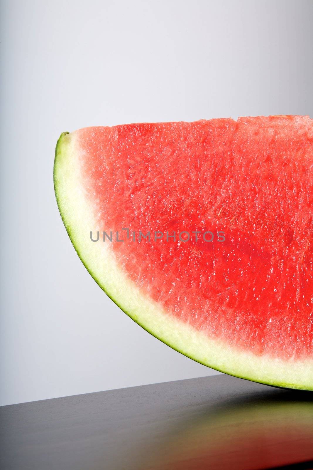 still life watermelon on wood table and white background