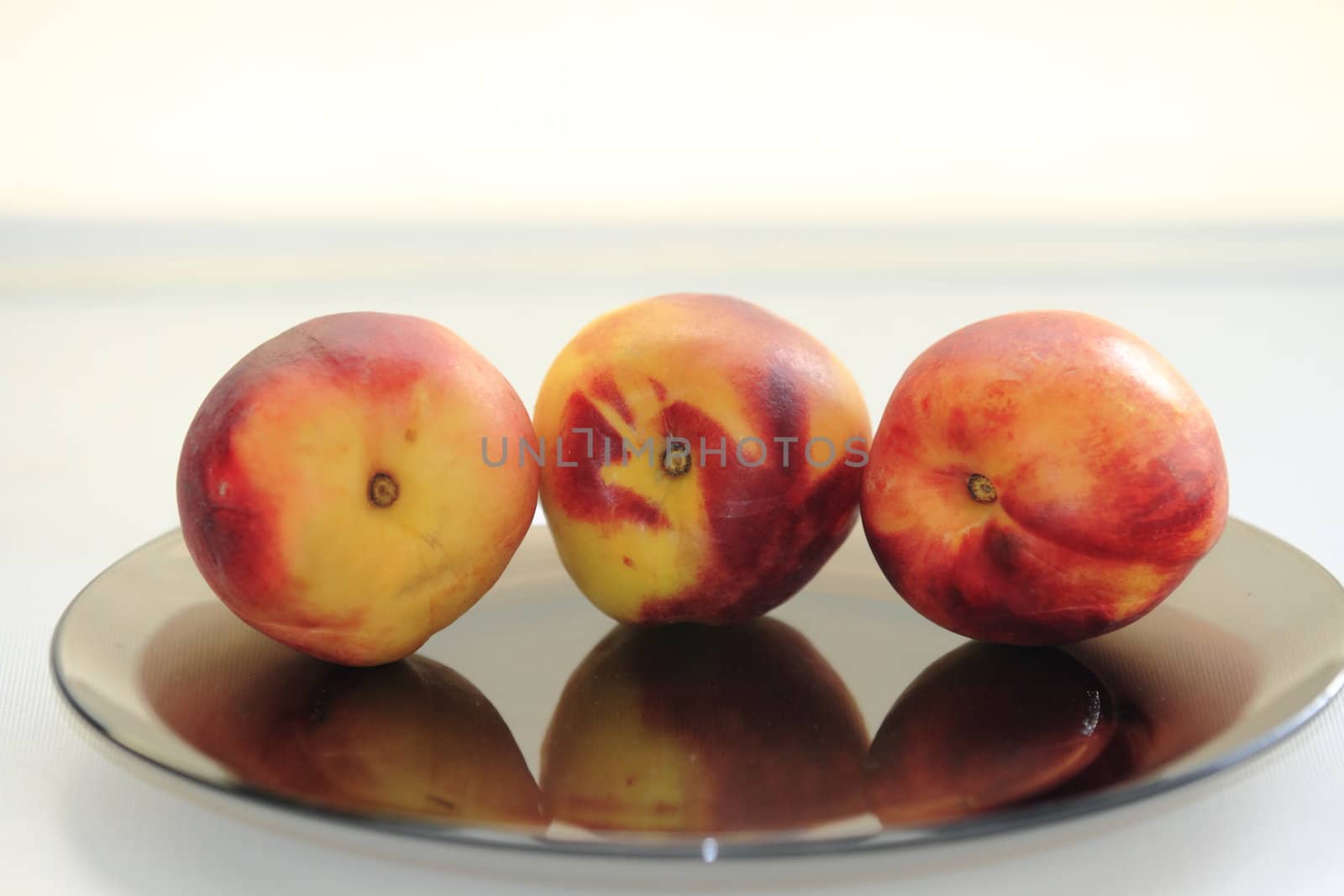 beautiful, delicious peaches  on a light background