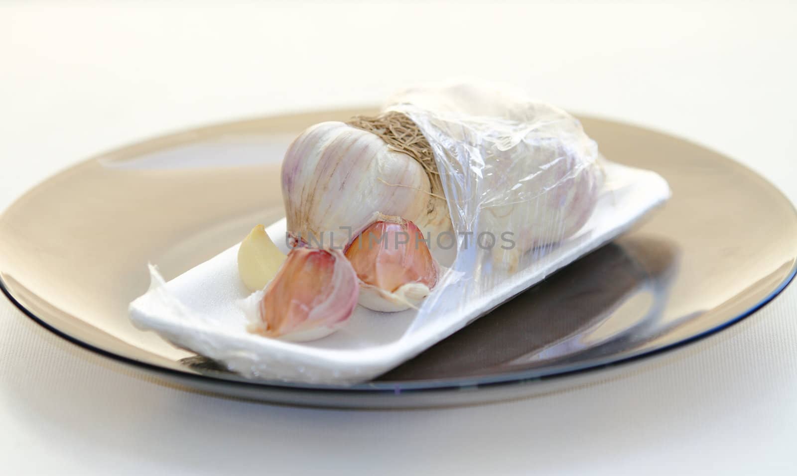 garlic in a package on a light background