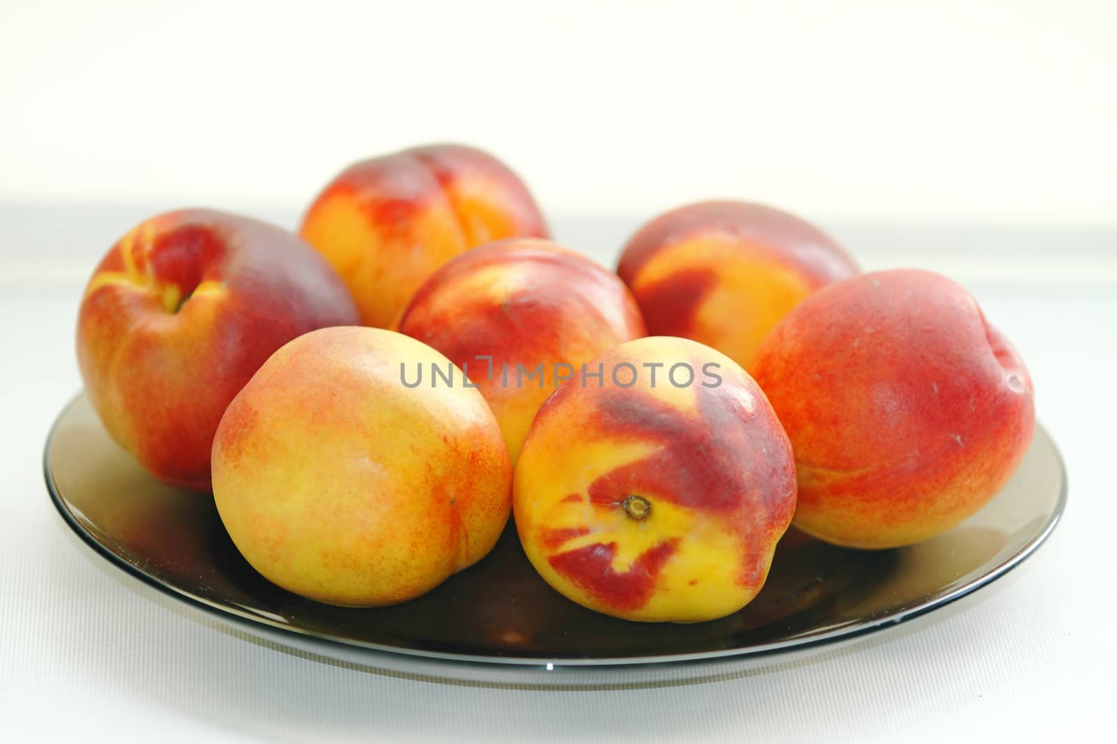 beautiful, delicious peaches  on a light background