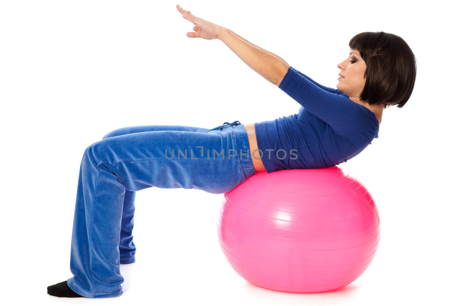 instructor showing exercises using fitball at gym to people