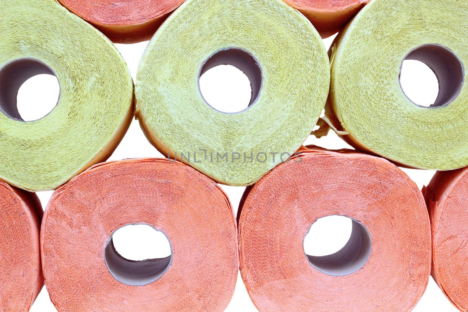 stack of yellow and pink toilet paper over white background