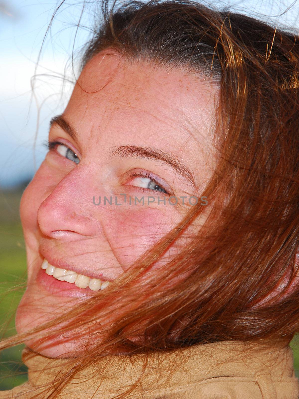 portrait of a beautiful happy ginger woman