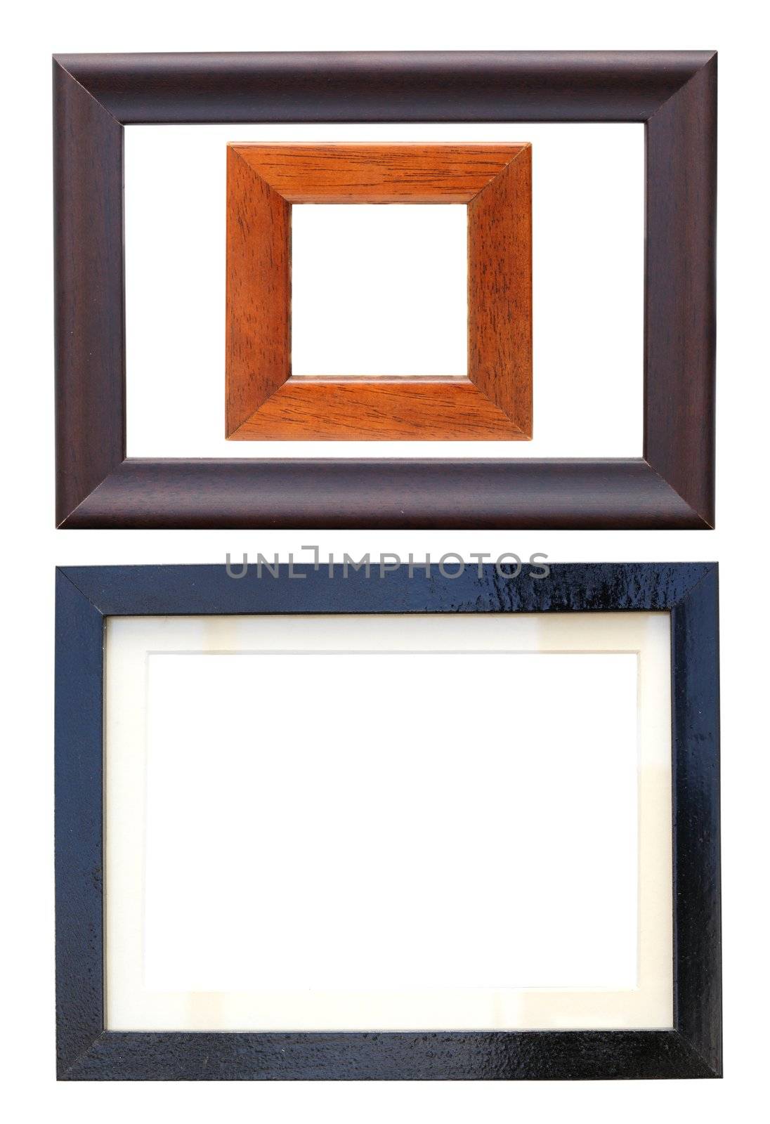 isolated shot of three wooden frames for photos