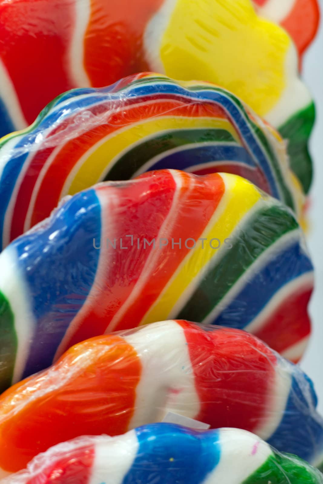 Candy in vivid bright colors on a stick
