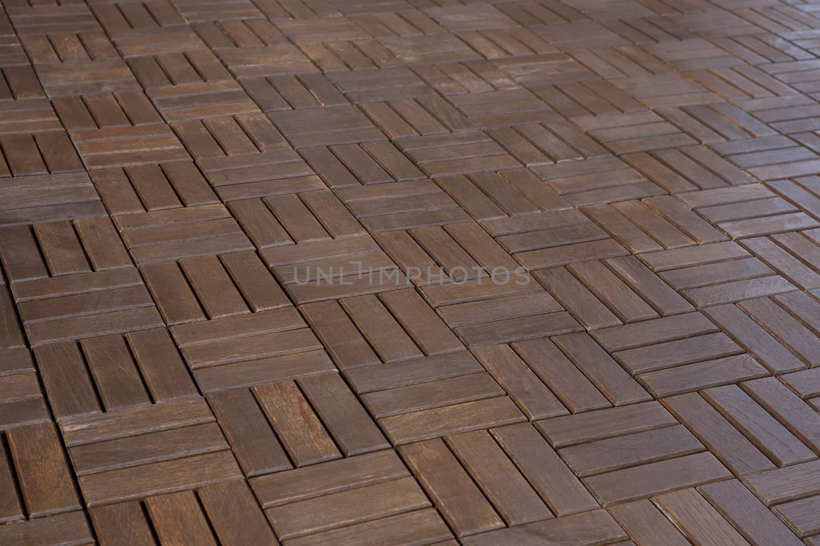 The texture of wooden parquet dark red-brown color