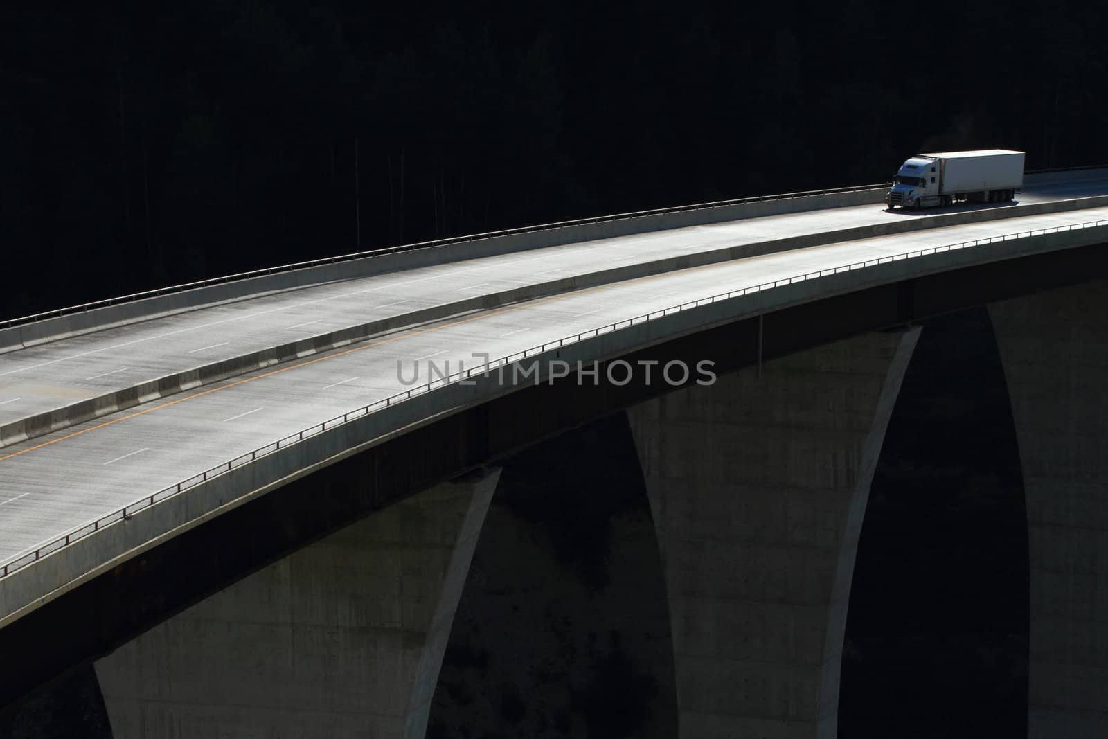Semi trailer truck crossing a high level bridge in British Columbia, Canada