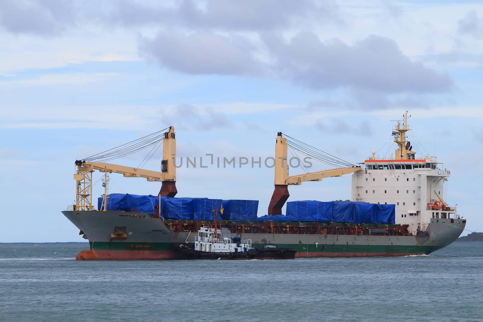 cargo ship heading for port by rufous