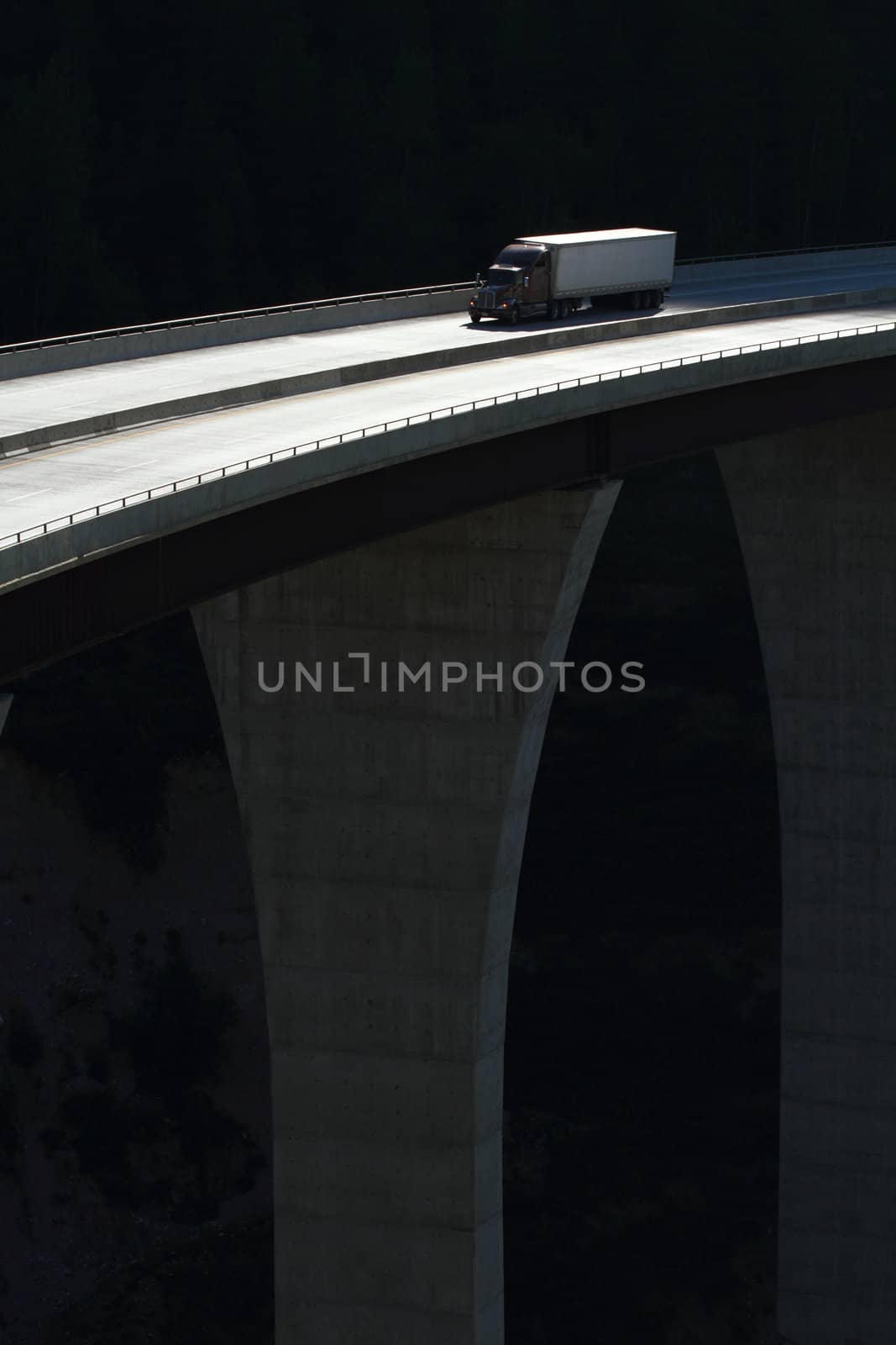 Semi trailer truck crossing a high level bridge in British Columbia, Canada
