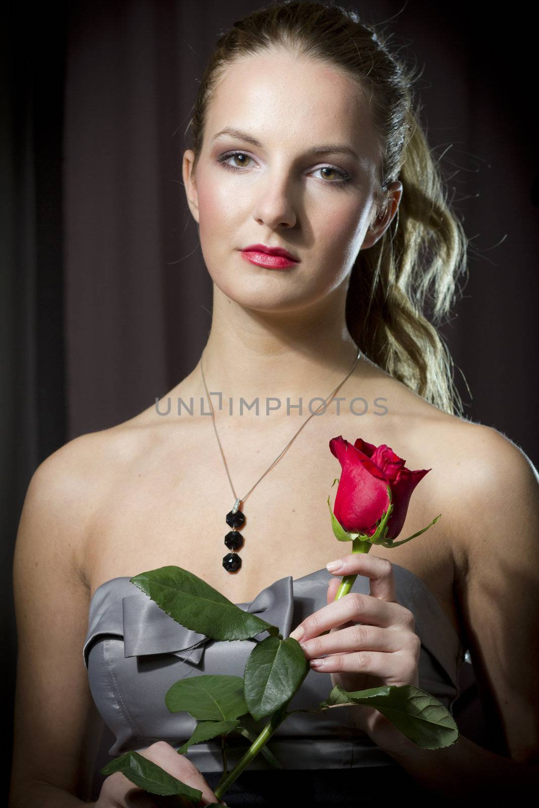 Attractive woman holding a rose on Valentine's day,