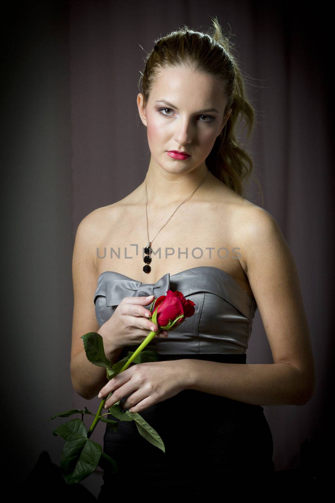 Attractive woman holding a rose on Valentine's day,