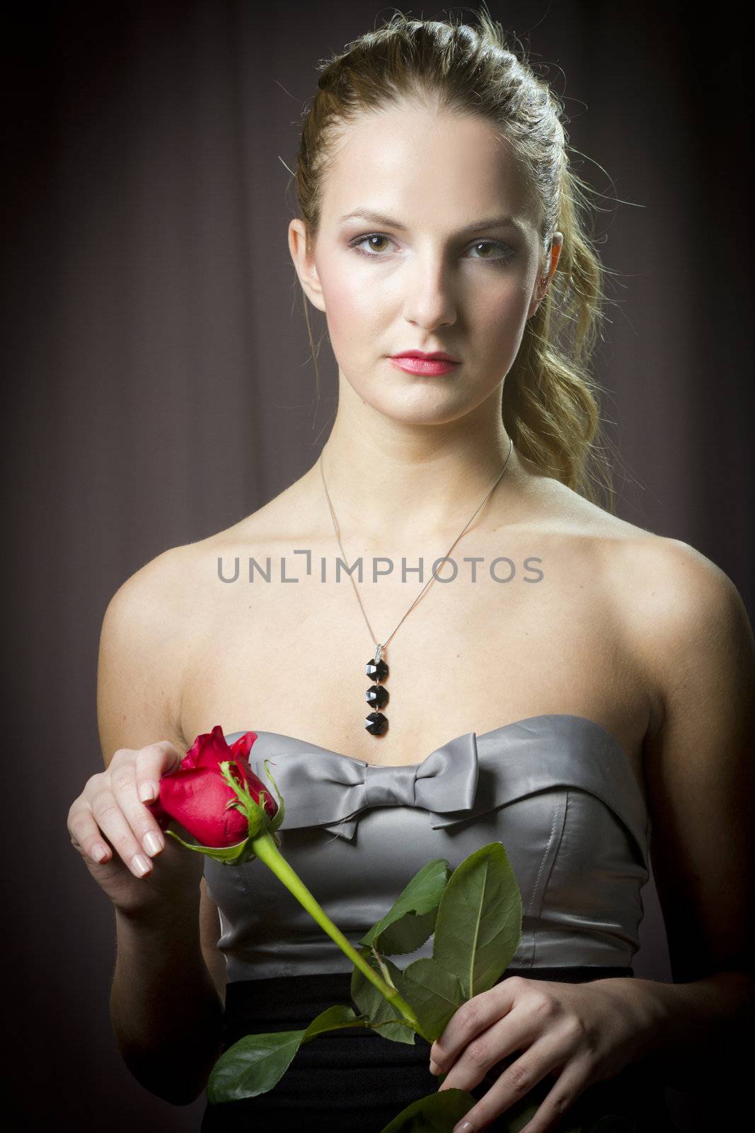 Attractive woman holding a rose on Valentine's day,