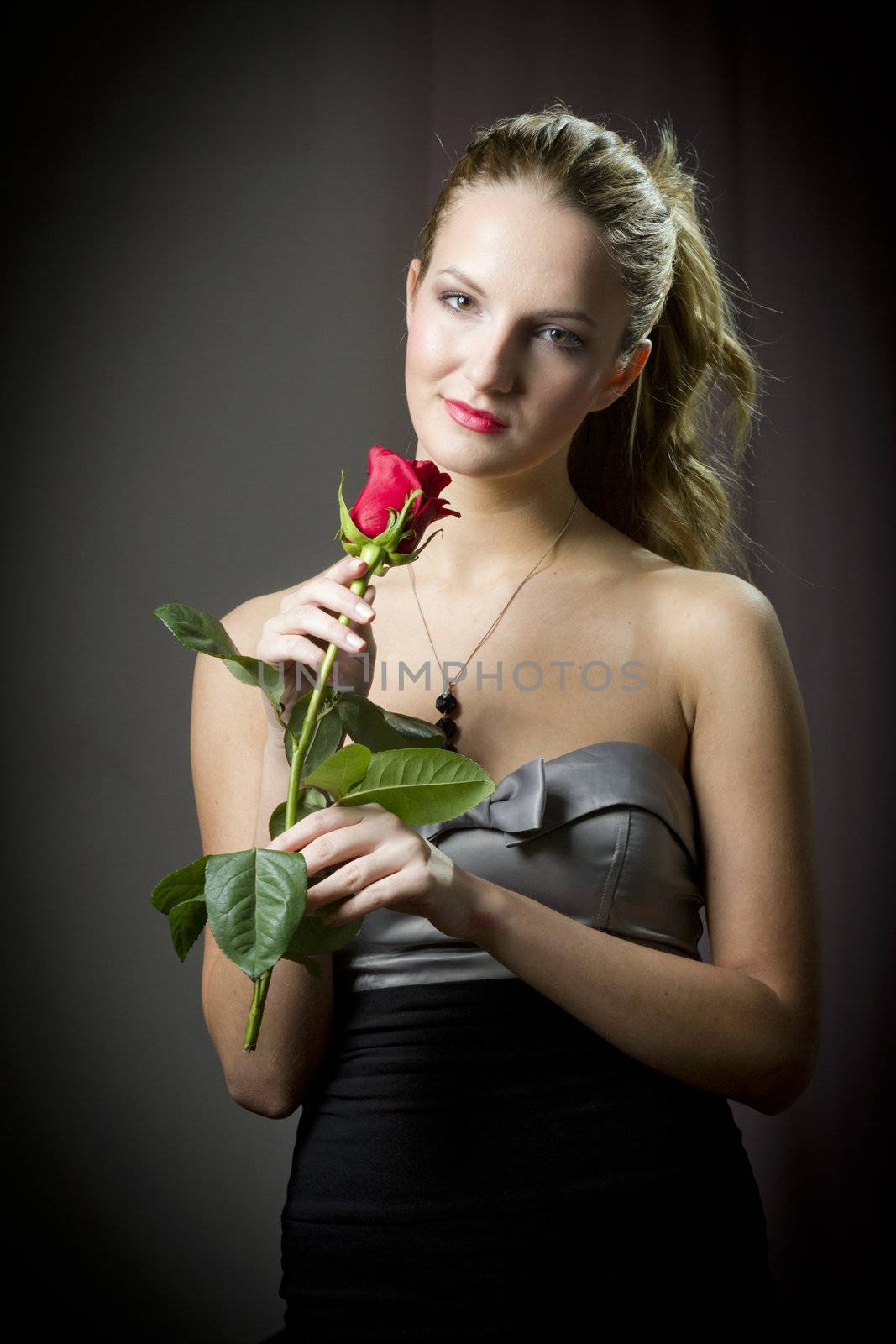 Attractive woman holding a rose on Valentine's day,