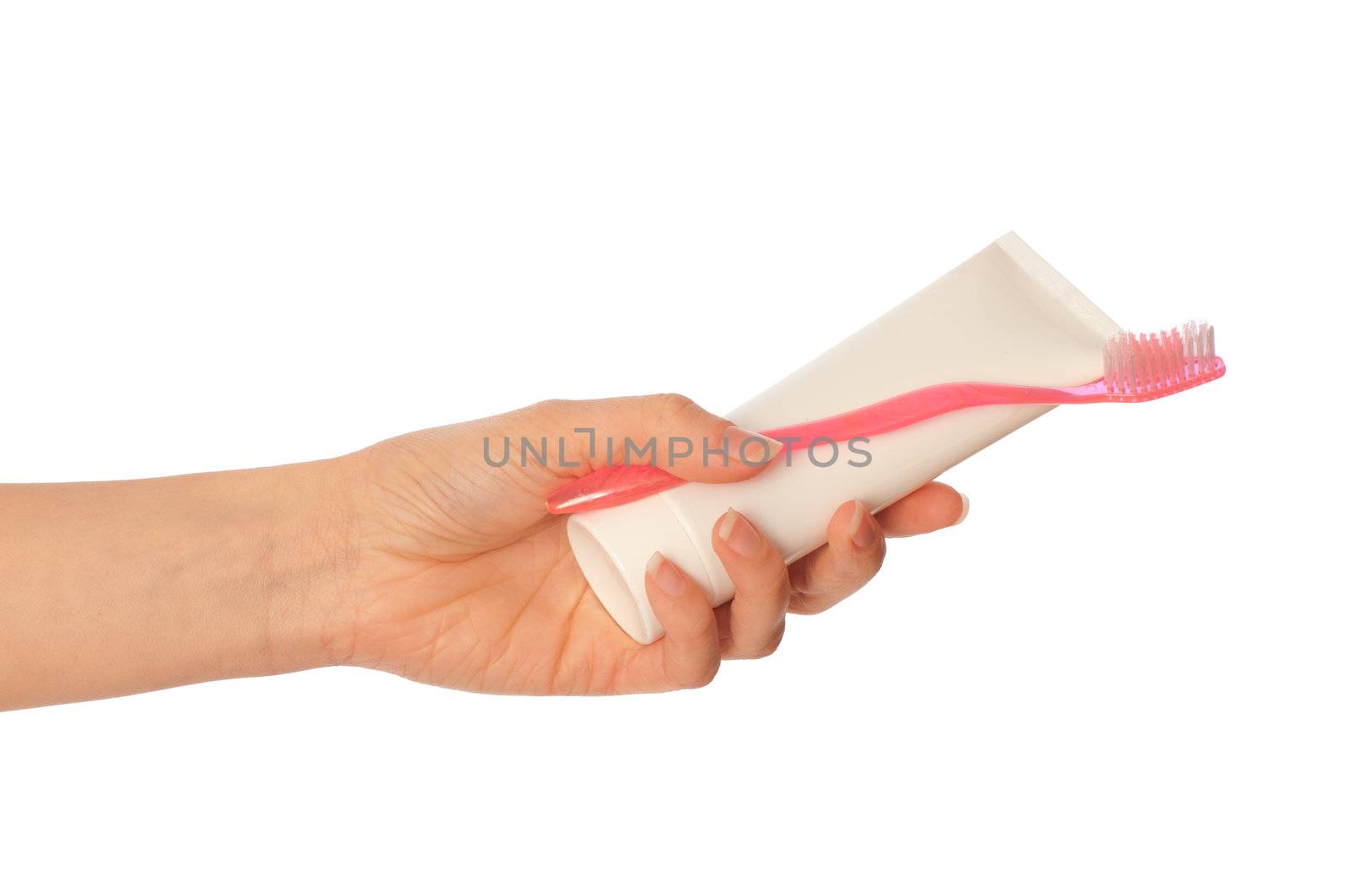 Tooth-paste and brush at in the girl's hand