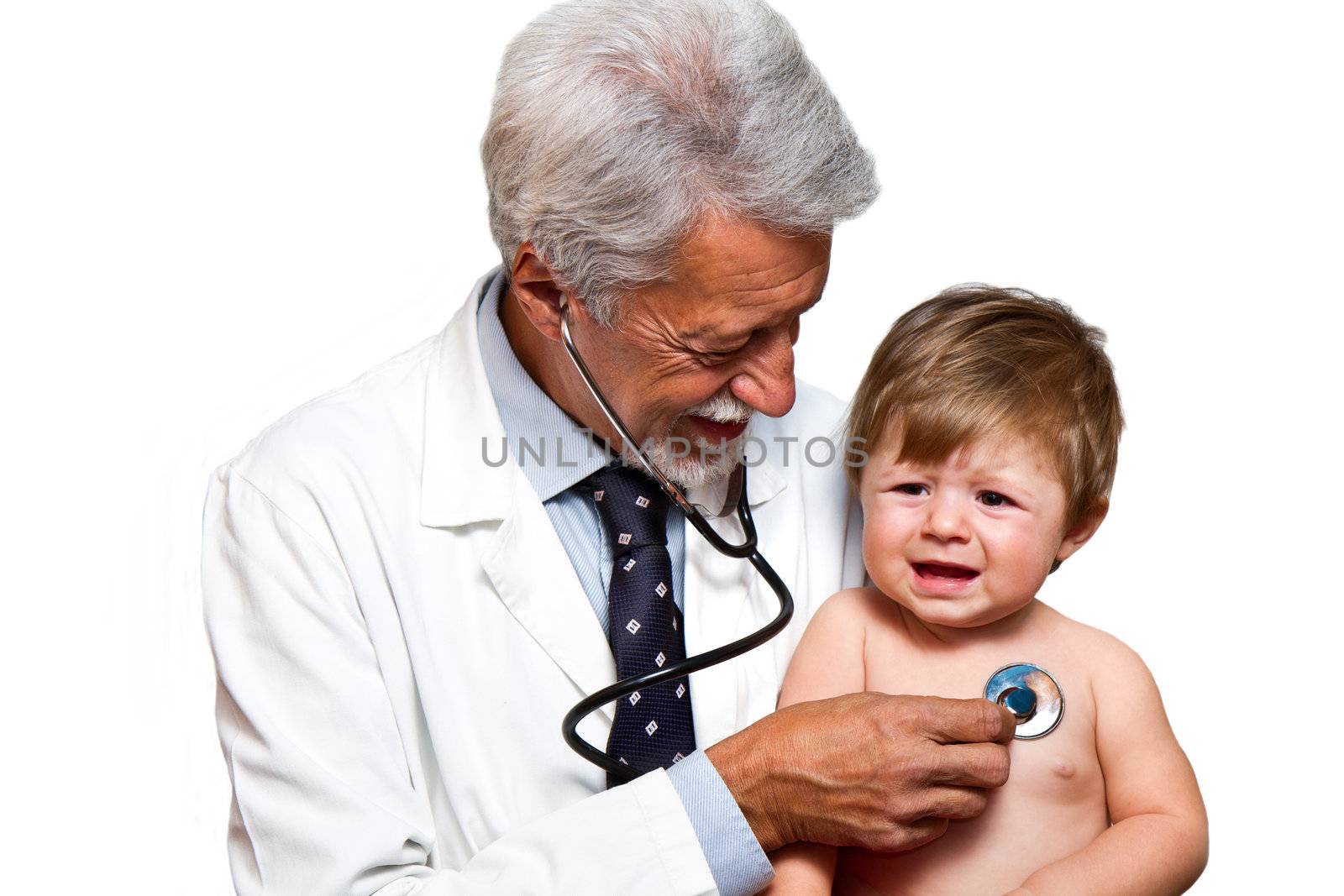 Male doctor examining a child patient in a hospital 
