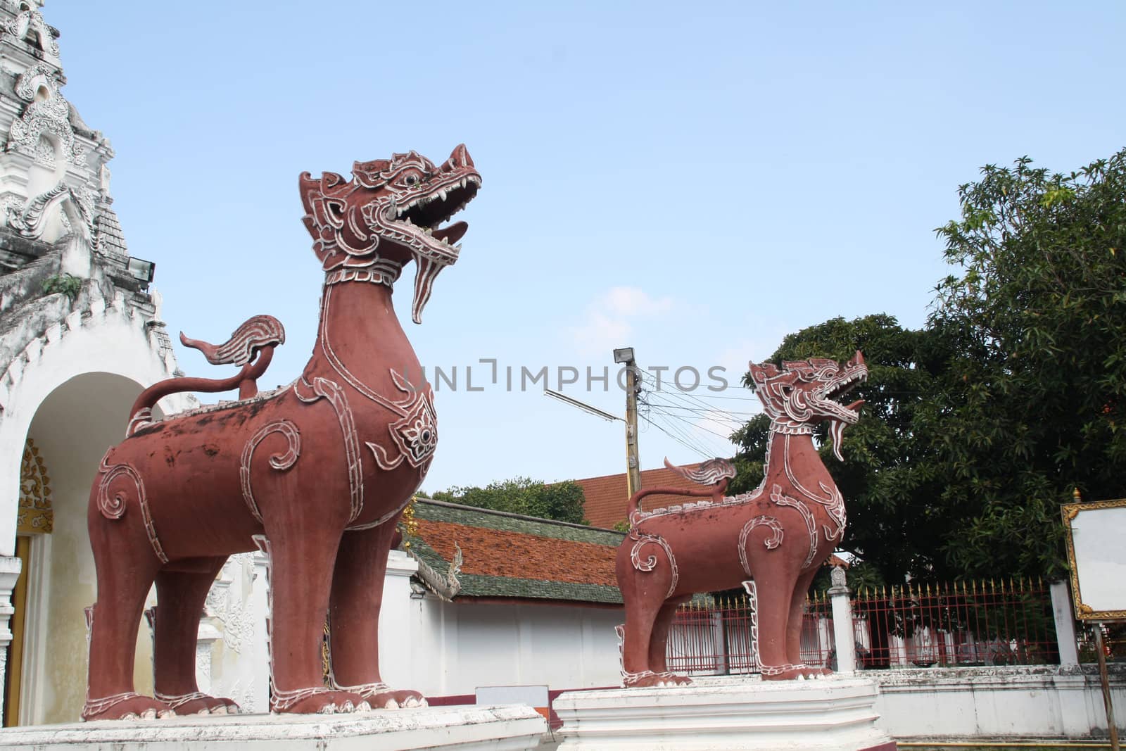 The lion statues. Wat Phra Lamphun, Lamphun, Thailand.