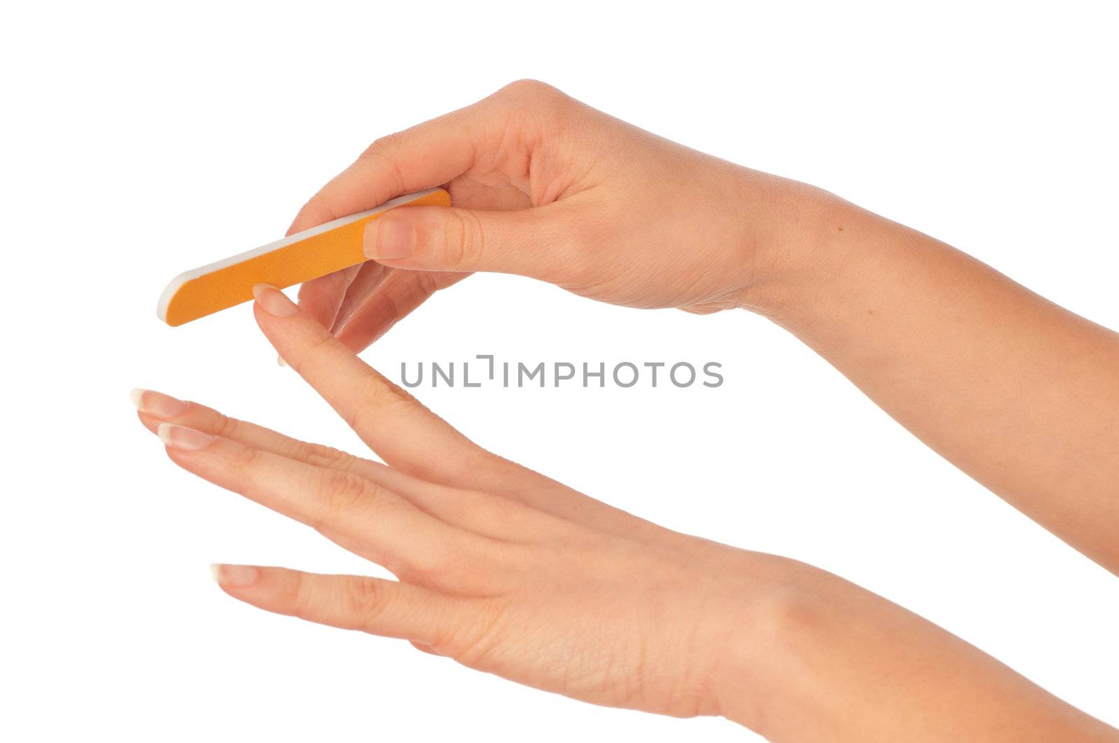 woman files her nails by emery board from manicure set