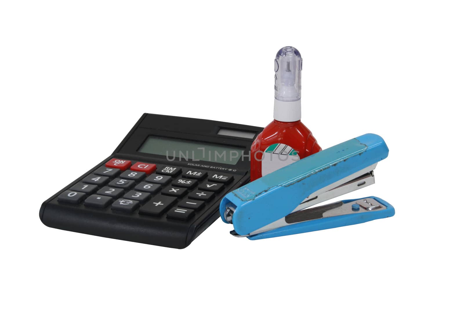 Office equipment. Calculator, a stapler and a liquid.