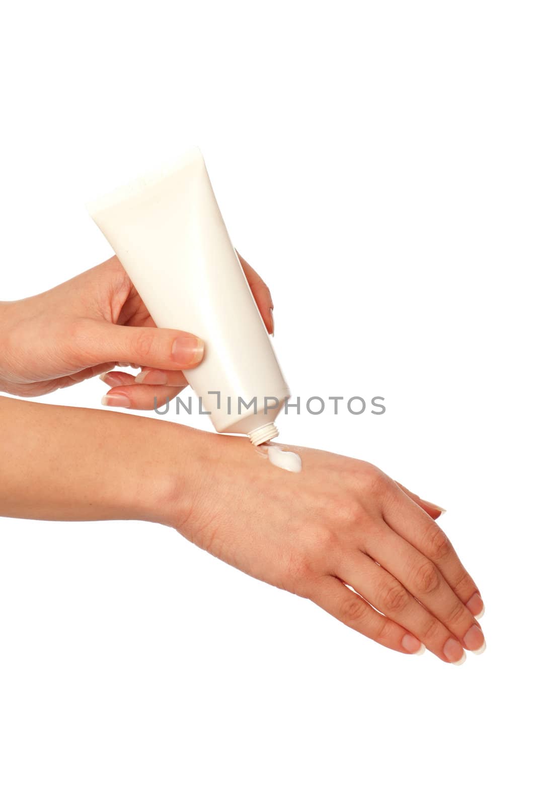 woman lubricates the hands skin with cosmetic cream