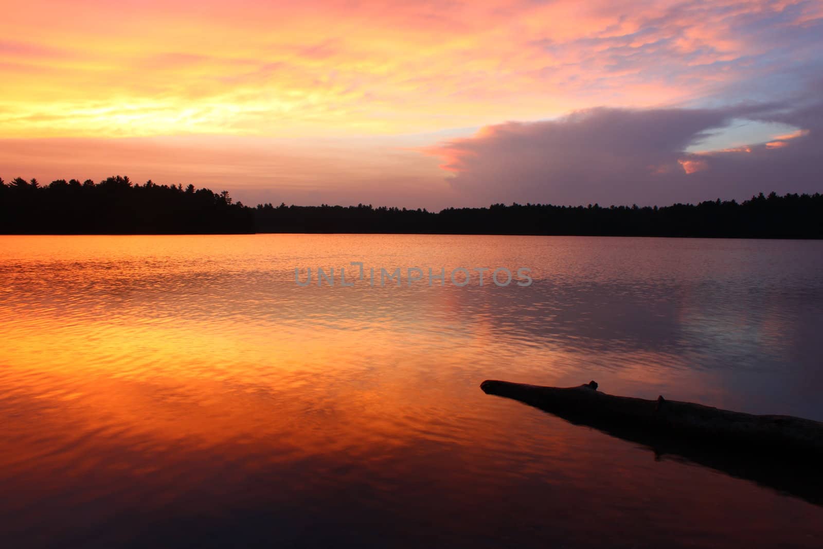 Brilliant colors of sunset over a northwoods Wisconsin Lake.