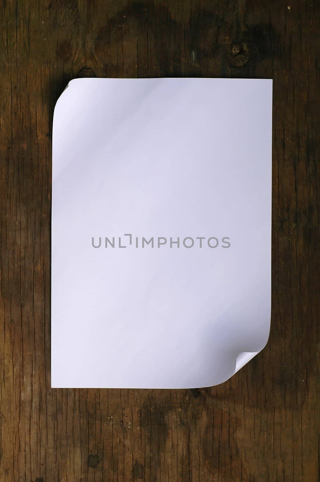 white paper on wood background by anankkml