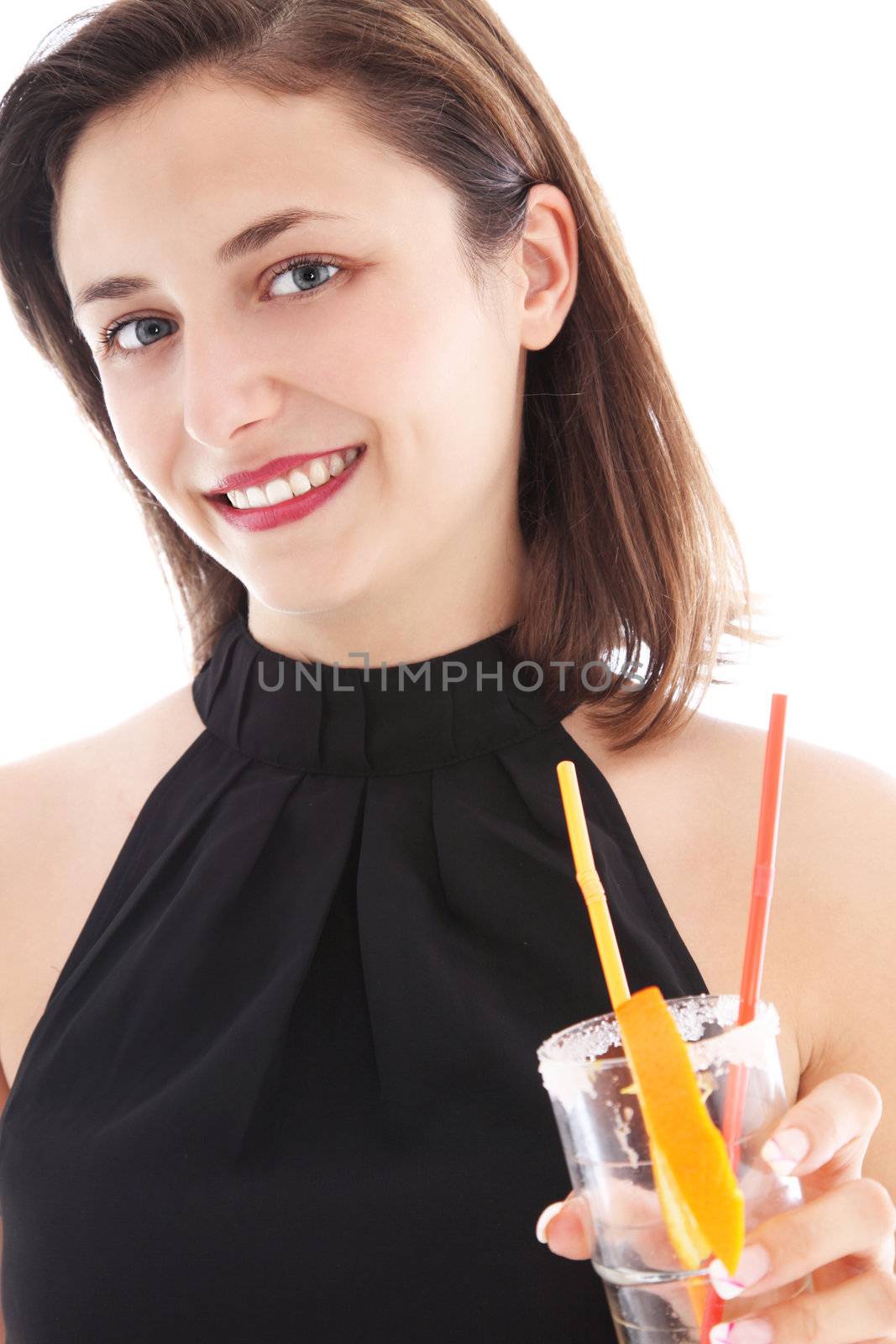 Stylish smiling woman in a black halter neck drinking a cocktail from a tall glass with frosted rim while socialising at a party or on vacation Stylish smiling woman in a black halter neck drinking a cocktail from a tall galss with frosted rim while socialising at a party or on vacation 