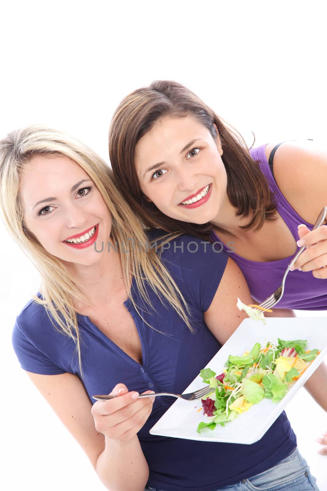 Women enjoying a healthy salad Women enjoying a healthy salad by Farina6000