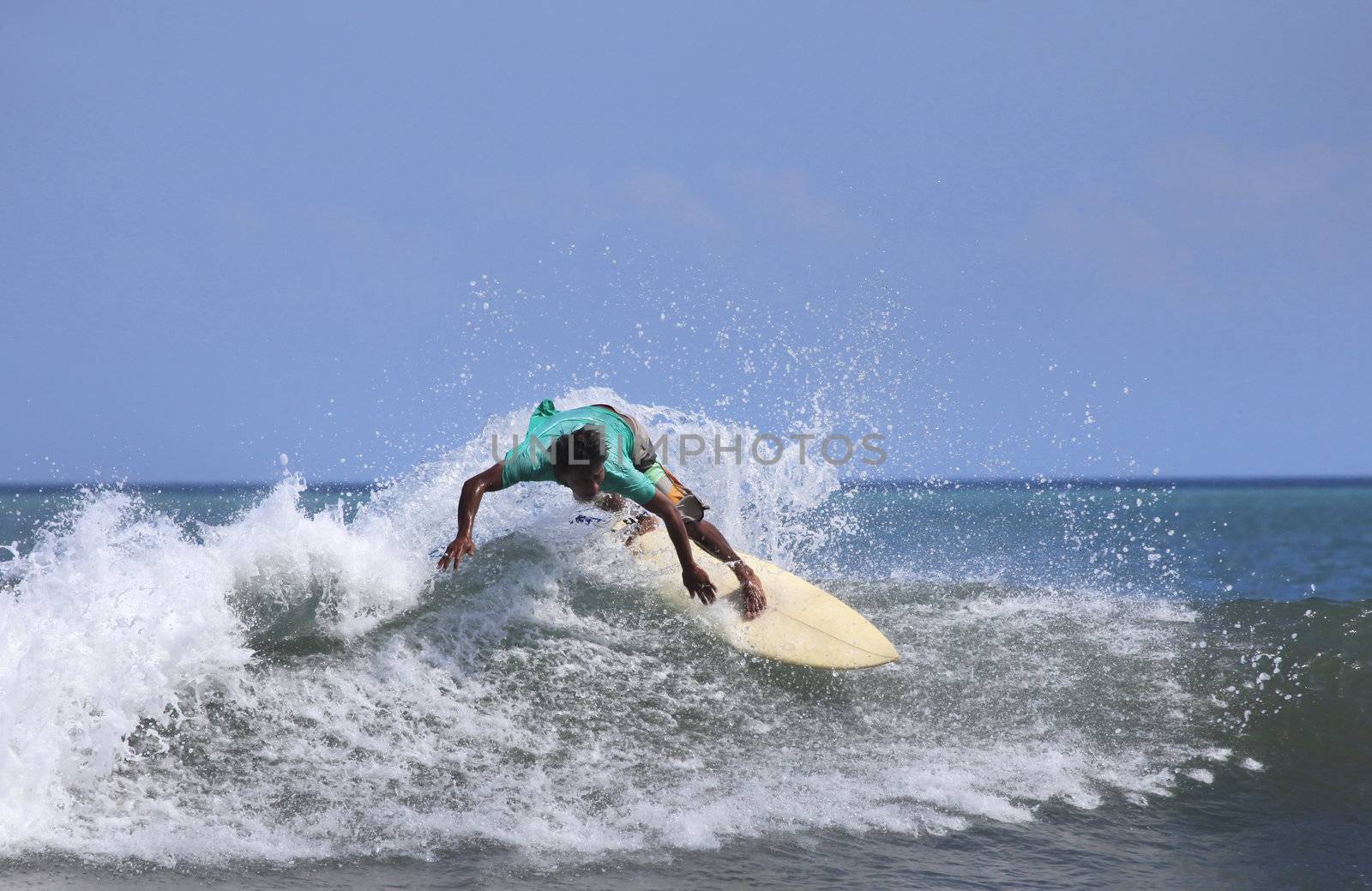 Man-surfer in ocean. Bali. Indonesia