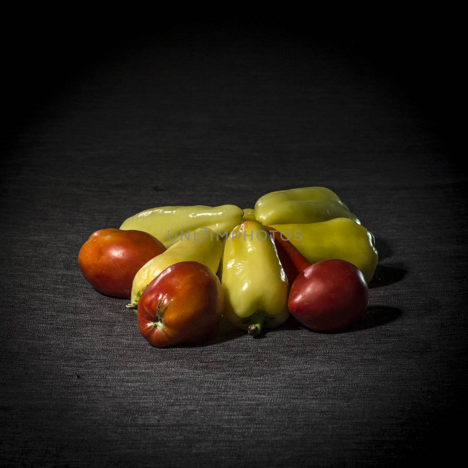 Organic vegetables on dark background, dramatic light