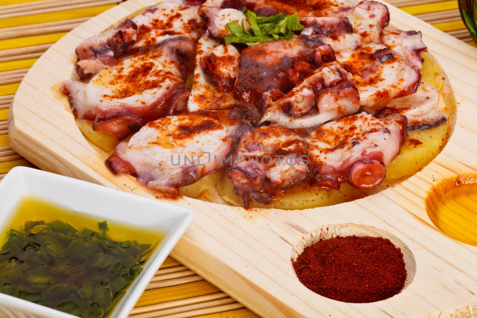 Octopus with paprika, potatoes and olive oil typical of Galicia, Spain